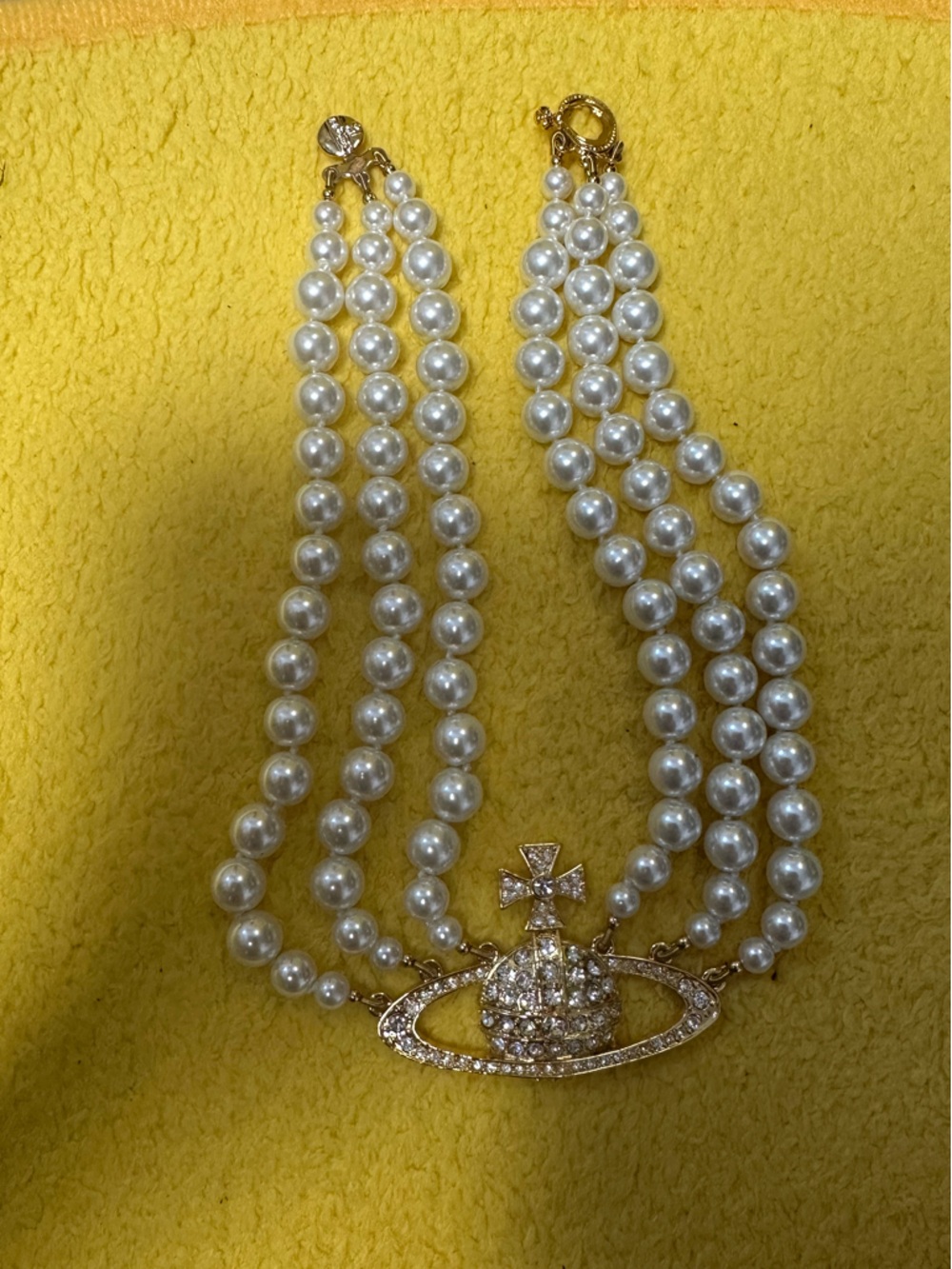 Vivienne Westwood three strand pearl choker in gold crystal